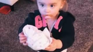 Little girl takes her dirty diaper to mommy.