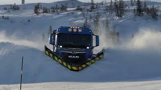 Truck plowing snow on Norwegian mountain top