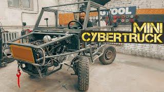 A man in a garage is building a unique mini Cybertruck.