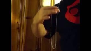 Man Demonstrates Impressive Chain and Ring Magic Trick
