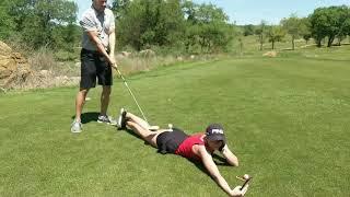 Teeing off her ass! Oops!