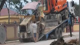 Loading excavator on lowboy