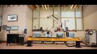 Integrated Robotic Assembly Cell with Dual Robots Articulated and SCARA