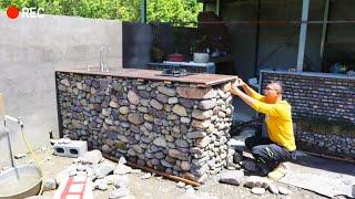 A farmer renovates his old farm house and builds a new kitchen and toilet