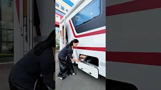 A large front RV with a rear door, a large kitchen and bathroom, and large water and electricity