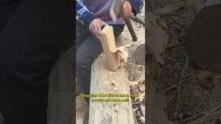 Chopping wood with an axe to make mortise and tenon nails