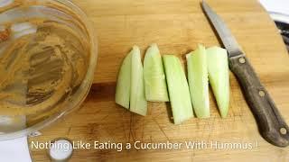 Eat A Cucumber From The Garden. With Hummus.