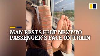 Man rests bare feet next to passenger’s face on train in China