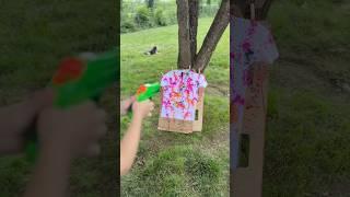 Who knew water guns could make the cutest tie-dye?!  #activities #tiedye #momlife #summerfun