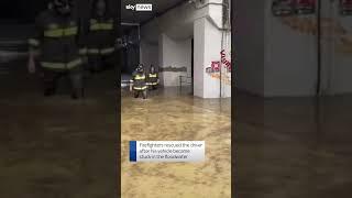 Driver rescued from floods in Italy