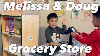 Playing with the Fresh Mart Grocery Store toy by Melissa & Doug