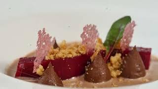 Beetroot salad. Salad with roasted beetroot, spinach, soft goat cheese and seeds in light plate over