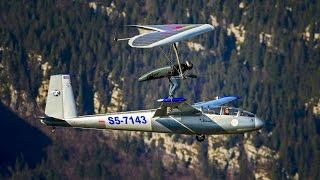 Hang Glider Touches Down on Sail Plane