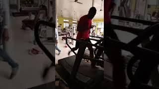 Test running a curved non electric heavy duty Vosan brand treadmill