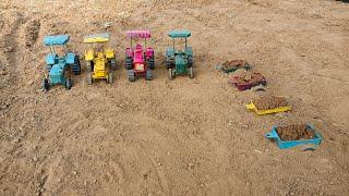 The tractor's trolley full of soil got buried under the soil and was attached to the tractor
