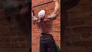 Natty cranking out reps on the weighed pull-ups in the yard #viral #workout #calisthenics