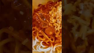 Delicious spaghetti with juicy cheesy hotdog