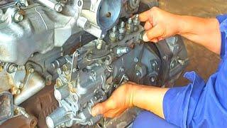 ISUZU 4HG1 engine rebuild,cylinder head,camshaft,  and injection pump installation and timing.