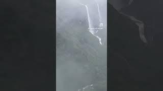 Lostinthe misty embrace of a foggy waterfall rain,where nature’s beauty whispers secrets of serenity
