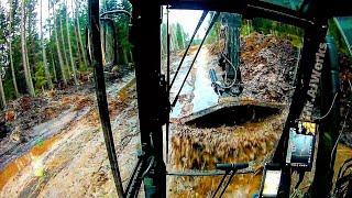 Draining Water From A Small Deep Puddle On A Forest Road