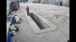 Worker walks on edge of pit until he falls