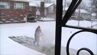 John Deere snowblower in action