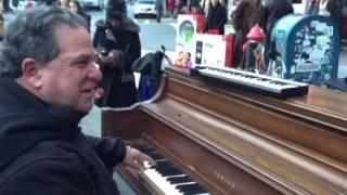 Mitch Woods plays piano on the streets of New York