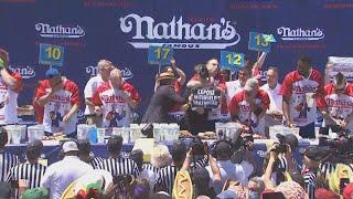 Joey Chestnut chokes protestor during Nathan's Hot Dog Eating Contest 2022