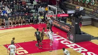 Matt Hodge takes off for a dunk over Duke commit Mackenzie Mgbako