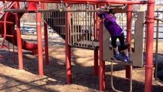 Emily on the monkey bars