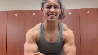 Teen muscle girl flexing