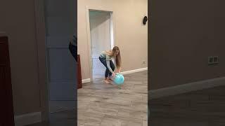 Tanya brings a blue balloon to the dogs