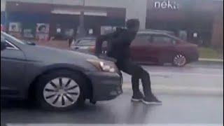 Man Tries To Stop Car, Gets Dragged Around For Several Minutes