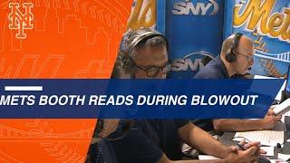 Gary Cohen, Keith Hernandez and Ron Darling read the media guide during a blowout