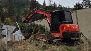 Final cleanup on the trash property with the Kubota KX 040 4