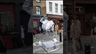 Silverman. London street performer, floating and levitating trick.