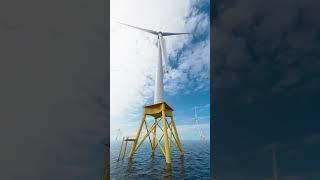 Offshore wind turbine with jacket foundation in a low angle shot