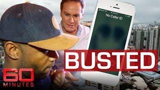 Reporter tracks down scammers in dramatic raid | 60 Minutes Australia