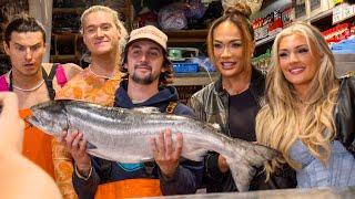 Nia Jax, Tiffany Stratton and Pretty Deadly throw fish at Pike Place Market in Seattle