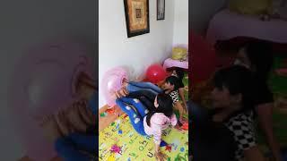 Girls Squeezing and Popping Balloons With Bare Feet