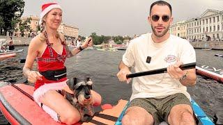 Paddling with crazy costumes in the river of St. Petersburg