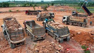 Massive Hyundai Dump Truck Unloading Big Rocks With Giant force Komatsu Bulldozer Pushing Big Stones