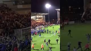 Colchester United players, fan celebrating in the stadium after victory against Spurs - Carabao  cup