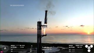 Mechanical SpaceX arms catch Starship rocket booster back at the launch pad