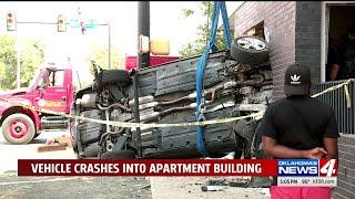 Emergency crews investigate after vehicle hits apartment building near Bricktown