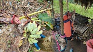 The orphan boy cut a banana for his younger brother to eat. His foster father came to visit.