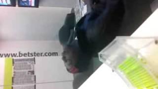 black bloke sleeping in the betting shop