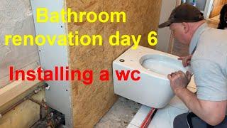 Bathroom renovations  day 6. Installing an off the floor wall hung WC pan.