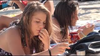 Candid smoking on the beach