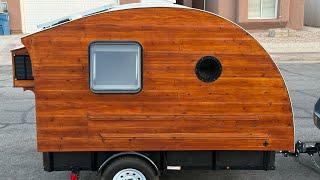 Innovative DIY camper trailer that blends design elements from teardrops and truck campers